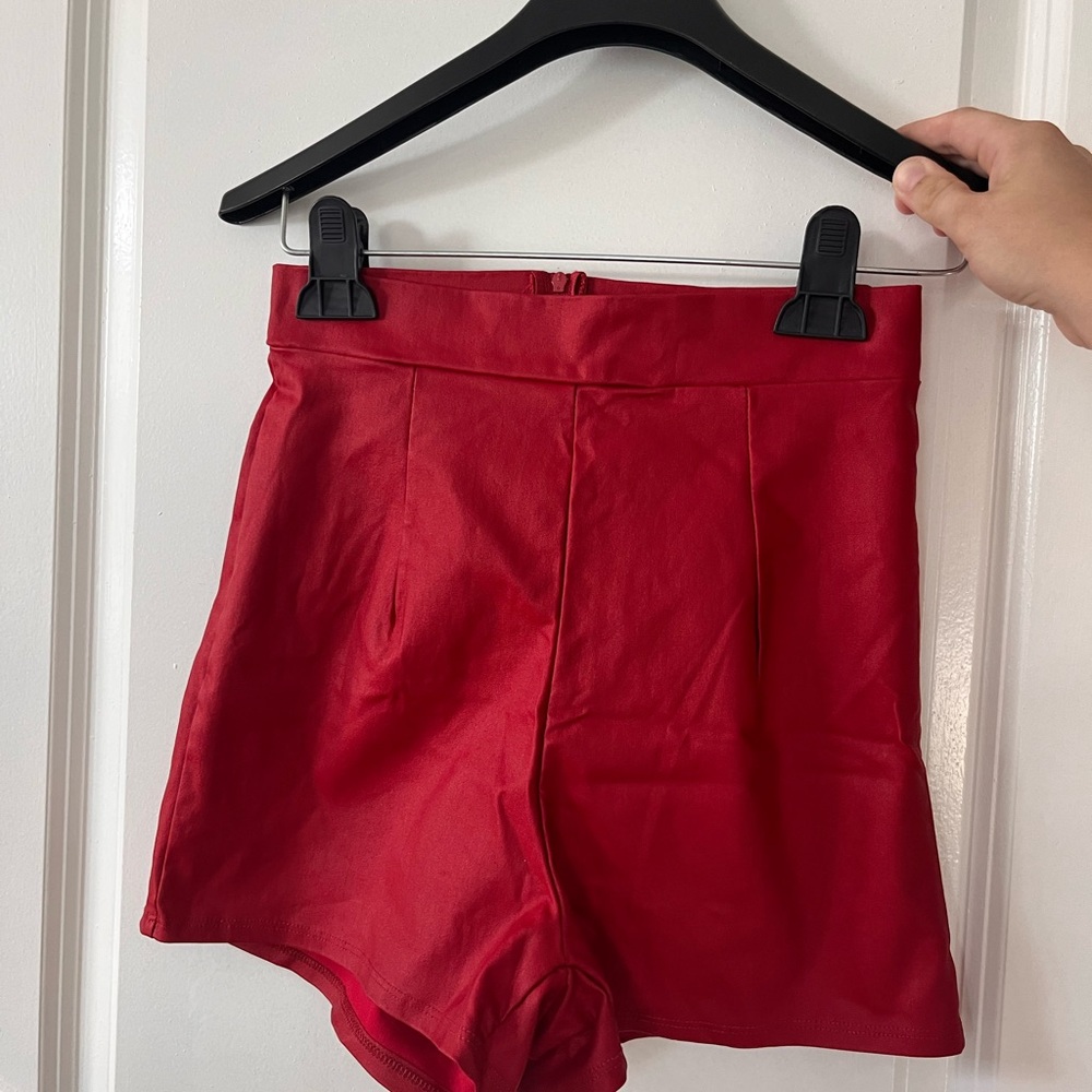 Red faux leather shorts